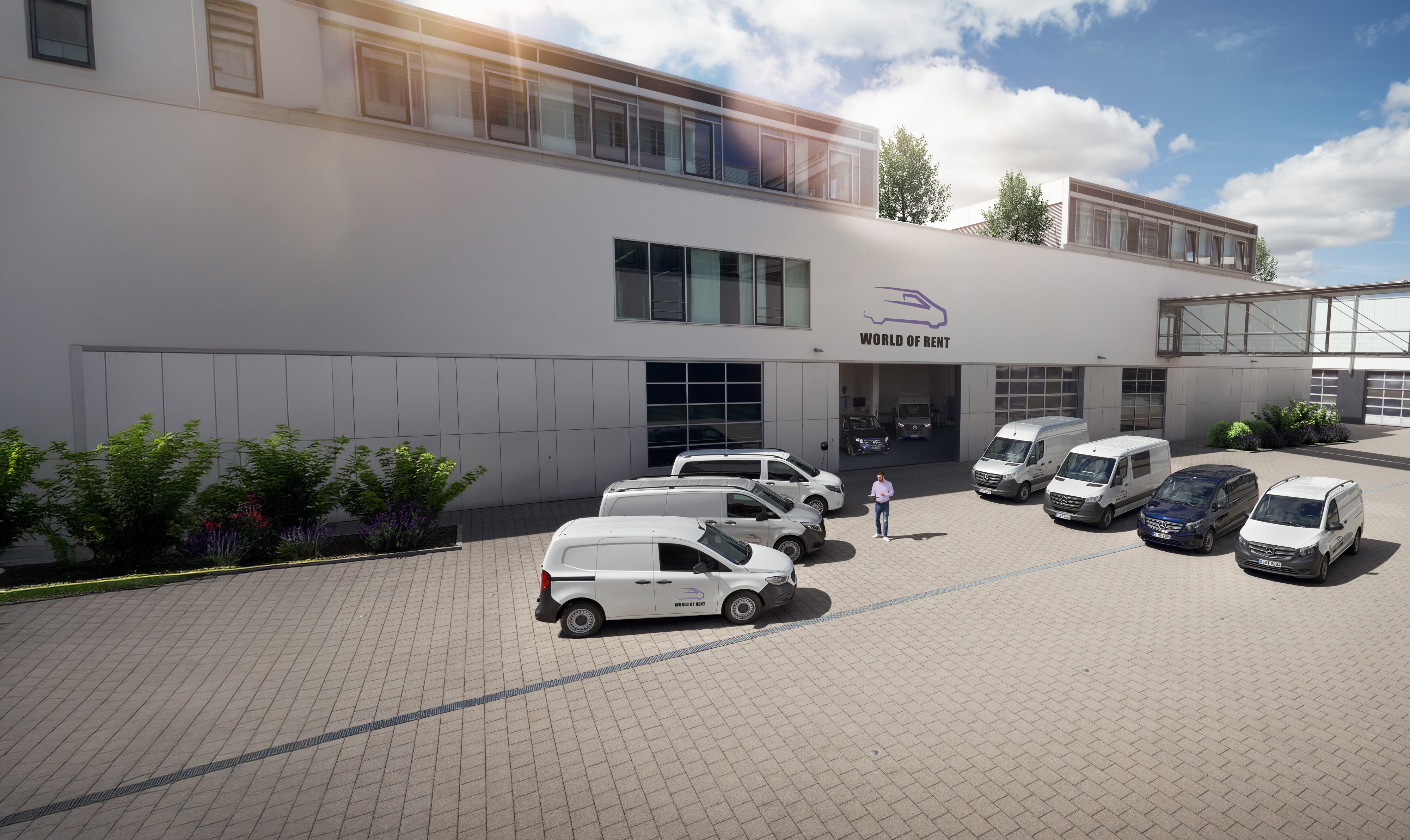 Mercedes-Benz | Przegląd usług | Usługi flotowe Flota samochodów dostawczych Mercedes-Benz przed budynkiem firmy.
